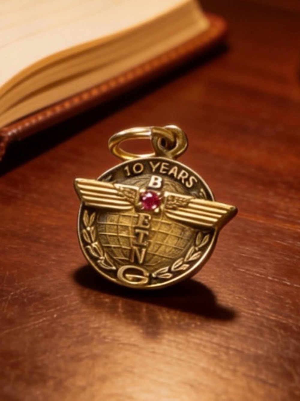 Gold-Tone 10 Years Wings Pendant with Pink Stone